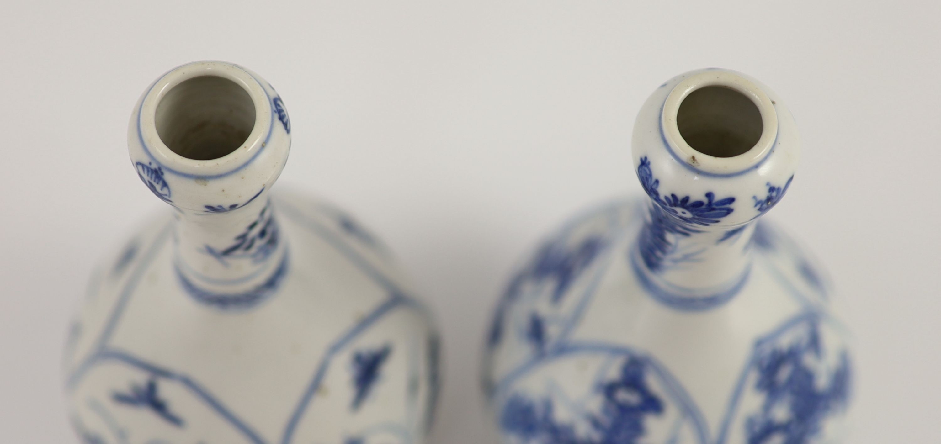 A pair of small Chinese blue and white garlic-neck vases, Kangxi period 13.5 cm high